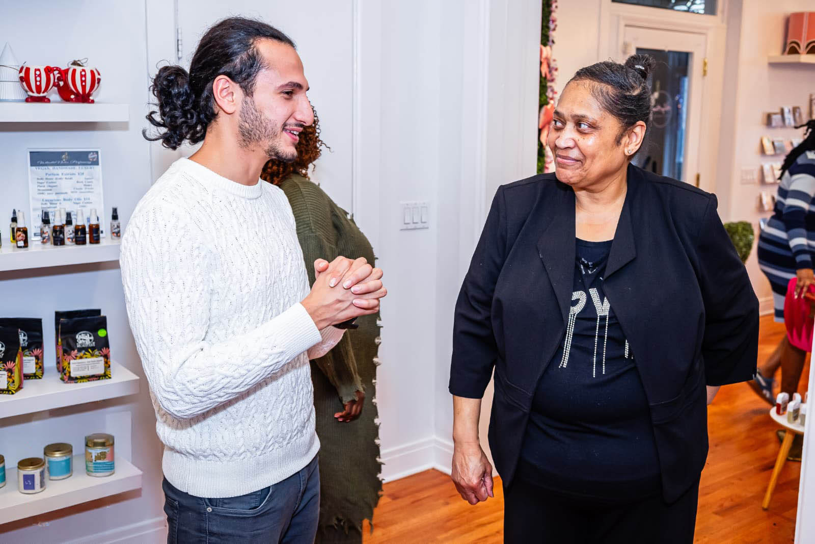 Abdallah Alkodah greeting a community member